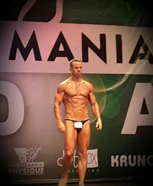 Mark stepping onto a bodybuilding stage in 2015, a goal he never set out to chase.